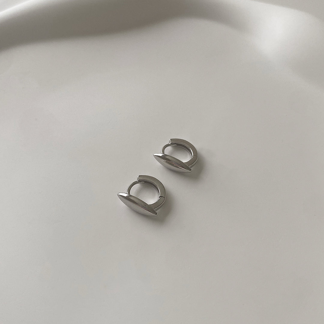 top side view of double point mini huggies in 925 sterling silver with rhodium plating