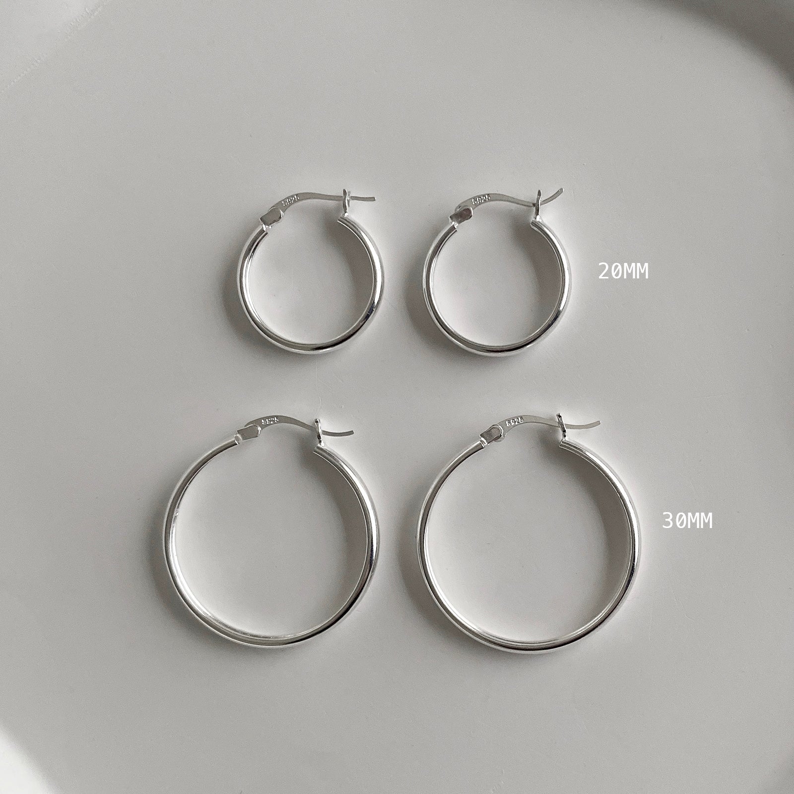 Jane Hoops are classic silver hoop earrings that come in 2 sizes:  20mm and 30mm diameters. 
